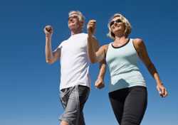 Mature, fit couple walking