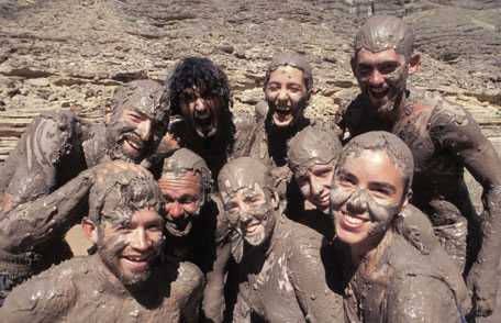 Photo of people in mud