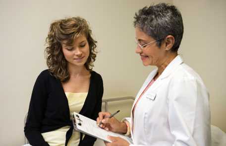 Doctor consulting with female patient