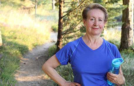 Mature woman holding water bottle