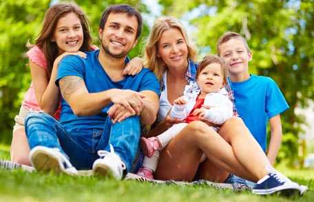 Family sitting on grass