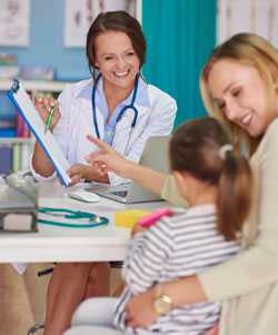 Doctor consulting with mother and child