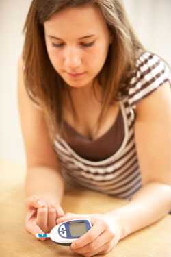 Woman checking blood sugar levels