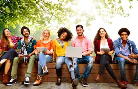 Large group of teens with laptops