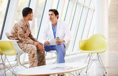 Doctor consulting with veteran