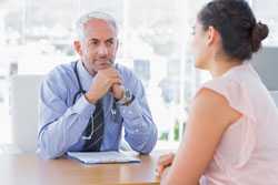 Doctor consulting with patient