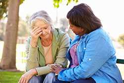 One woman consoling another one