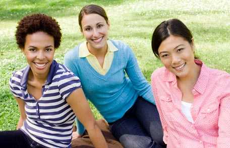 Three women smiling