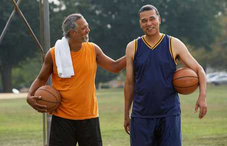 Two men playing baskeball