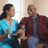 Photo: Nurse taking patient's blood pressure