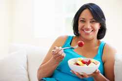 Woman eating fruit