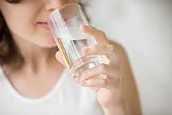 Woman drinking glass of water