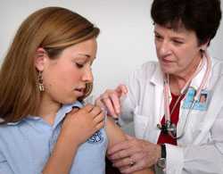 Teenage girl getting vaccinated