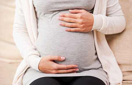 Photo: Baby sleeping on woman's stomach