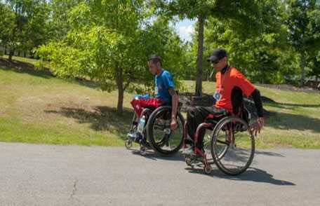 Two men in wheelchairs