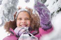 Girl playing outside in winter