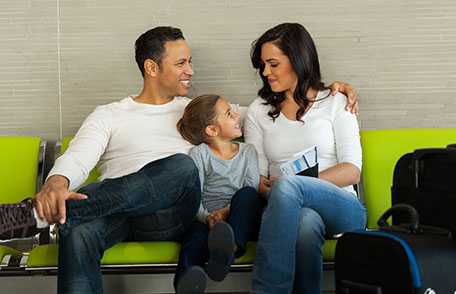 Family waiting for plane at airport