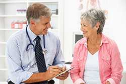 Woman talking with doctor