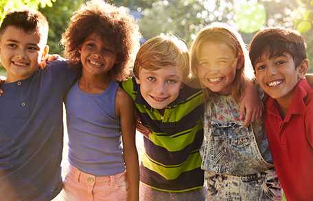 Three children smiling