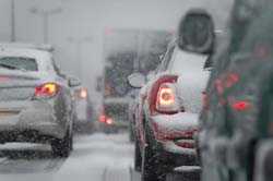 Cars driving on snowy road