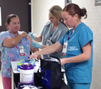 Flu cart and operating room nurses, Teri Bartosovsky and Shelli Henry.