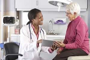 Female doctor and older female patient.