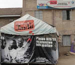 Signs outside Komarock Clinic, in Nairobi, Kenya, let the community know they can be tested and treated for HIV and TB.