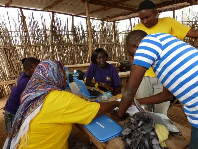 In Garfasa, Kenya, Kenya Medical Research Institute staff provide IT support for the netbooks used by interviewers in implementing the Kenya AIDS Indicator Survey.