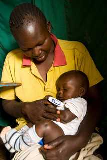 A young mother in the Kibera informal settlement in Nairobi is interviewed by a community interviewer as part of ongoing IEIP research by CDC-Kenya. The information gathered from these regular visits helps the CDC to track potential outbreaks of disease in the crowded and unsanitary settlement. © David Synder