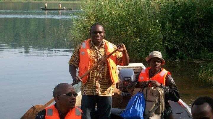 FELTP trainees and supervisor riding on a boat on their way to Nkombo island, Rusizi district during an outbreak investigation.