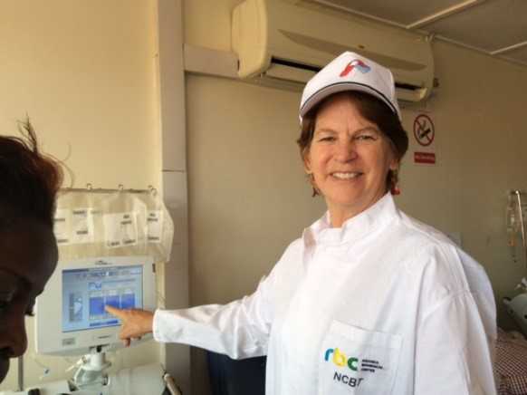 Dr. Gene MacDonald, CDC Rwanda’s Country Director during a site visit at Rwanda’s National Center for Blood Transfusion (NCBT). Dr. MacDonald is pointing at one of several Apheresis machines at NCBT which were bought using funds from CDC Rwanda. 