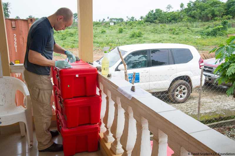 	CDC staff at Bo Lab in Sierra Leone prepare newly delivered samples for testing.  