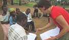 FELTP resident Jacques Likofata and Epidemic Intelligence Officer Dr. Leisha Nolen conducting an interview with a household in the Democratic Republic of Congo during the 2013 human Monkeypox outbreak