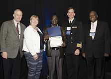 Dr. Alex Opio accepts the Director’s Award for the Uganda Public Health Fellowship Program, Field Epidemiology Track.