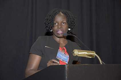 Lydia Nakiire of Uganda presents her research on a measles outbreak among children congregating at a water collection site at the 2017 FETP International Night.