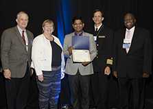 Rajesh Sahu of India accepts the 2017 William H. Foege Award.