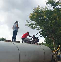 testing free chlorine residual in a water truck that has just been filled (Source: Anu Rajasingham, CDC)