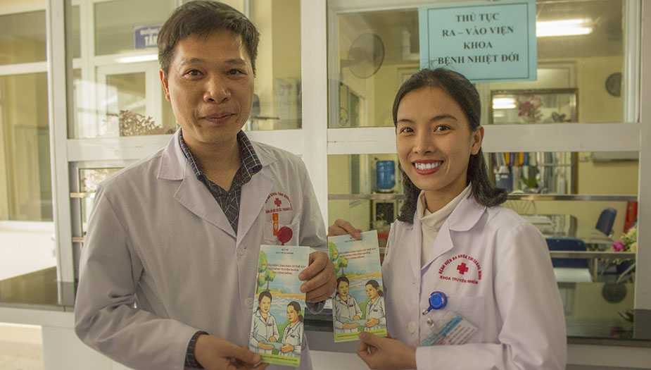 Doctors with event-based surveillance (EBS) materials during cascade training to roll out the EBS in a pilot province and later monitoring visit. Photo Courtesy: Cuc Hong Tran, PhD