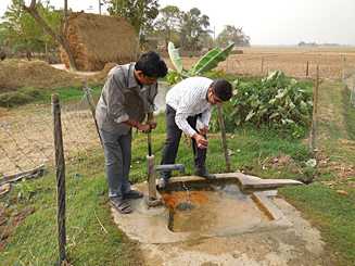 Collecting a water supply sample from a house during an acute gastroenteritis outbreak investigation. 