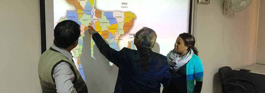 Ministry of Health officials and IMPACT team lead discuss and choose the fellows’ field site placements in Bangladesh.