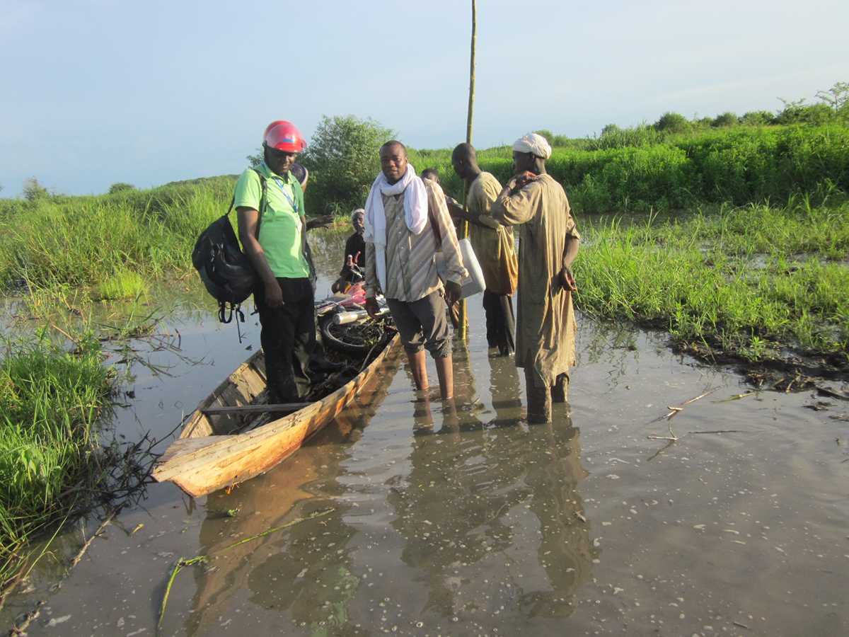 Several communities exist on small islands within certain region of Chad. Members of these communities may miss routine immunizations or mass vaccination campaigns if water levels get too high. Stop Transmission of Polio (STOP) team member and vaccinator Freddy Banza boards a canoe to travel through the flooded areas of Chad to vaccinate children.  