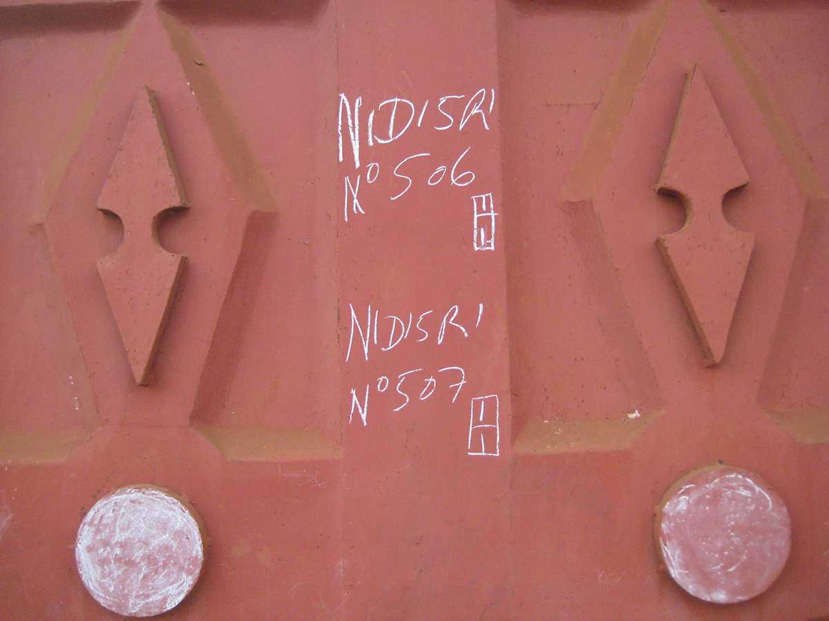 Cameroon: Vaccination team markers on homes indicate that the homes were visited and that children in the homes were vaccinated.