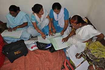 	Auxiliary nurse-midwives practice developing annual immunization plan during regular meeting. Photo courtesy of Steve Stewart, CDC.