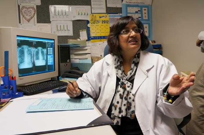 Created on September 11, 2012, this photograph was captured inside the Prince Cyril Zulu Clinic, the largest government out-patient TB, and STD treatment facility in Durban, South Africa. In this view a clinical radiologist was reviewing a patient’s chest x-ray, discussing her findings with a colleague. The U. S. Centers for Disease Control and Prevention (CDC) supports HIV & TB research at Prince Cyril Zulu Clinic, where results inform the World Health Organization (WHO) and the U.S., as to appropriate guidelines to be followed when treating co-infected patients, and preventing the spread of diseases.