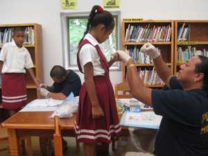 Public health worker collecting blood in American Samoa. Credit: CDC photo, Angela Keller