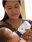 woman feeding baby