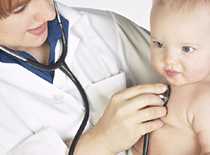 Doctor listening to a baby's heart.