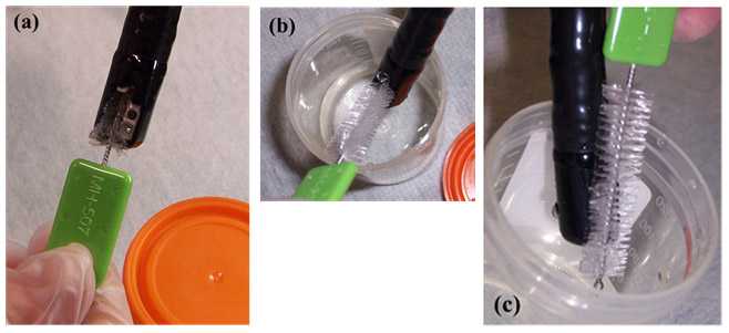 Figure 3. Sampling the elevator mechanism in the (a) âlowered/ closedâ position, (b) âraised/ openedâ position, and (c) sampling the elevator mechanism and lens face (photos taken by CDC DHQP).