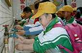 global handwashing day - children washing their hands at a school in china