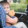 	Boy in a car seat with a teddy bear